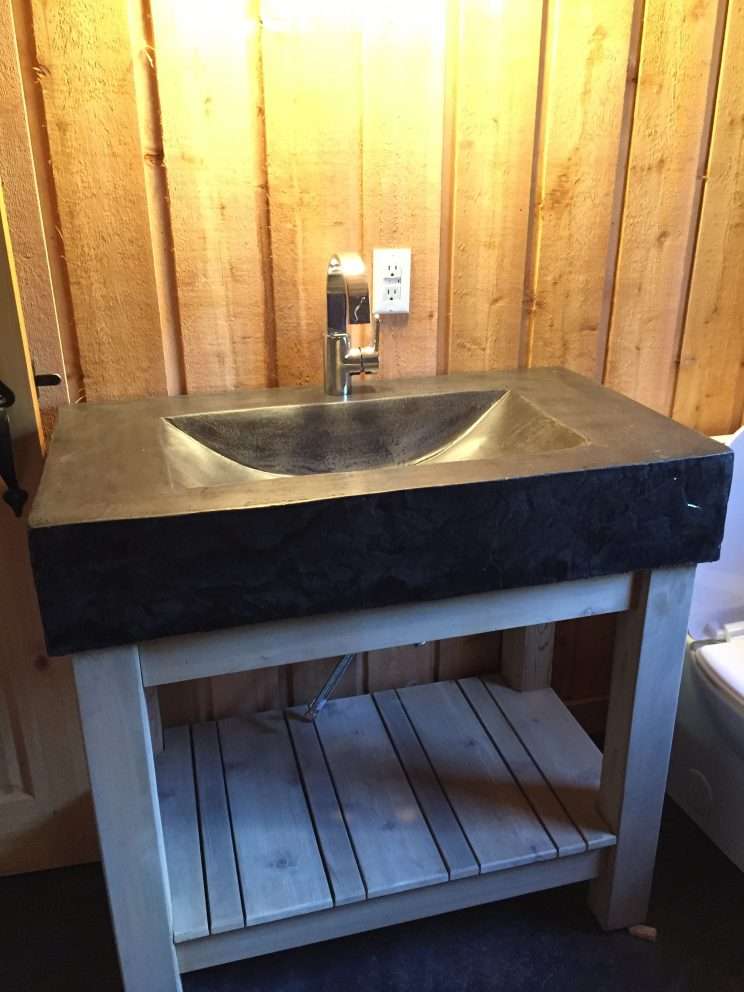 poured concrete kitchen sink on cedar wood frame
