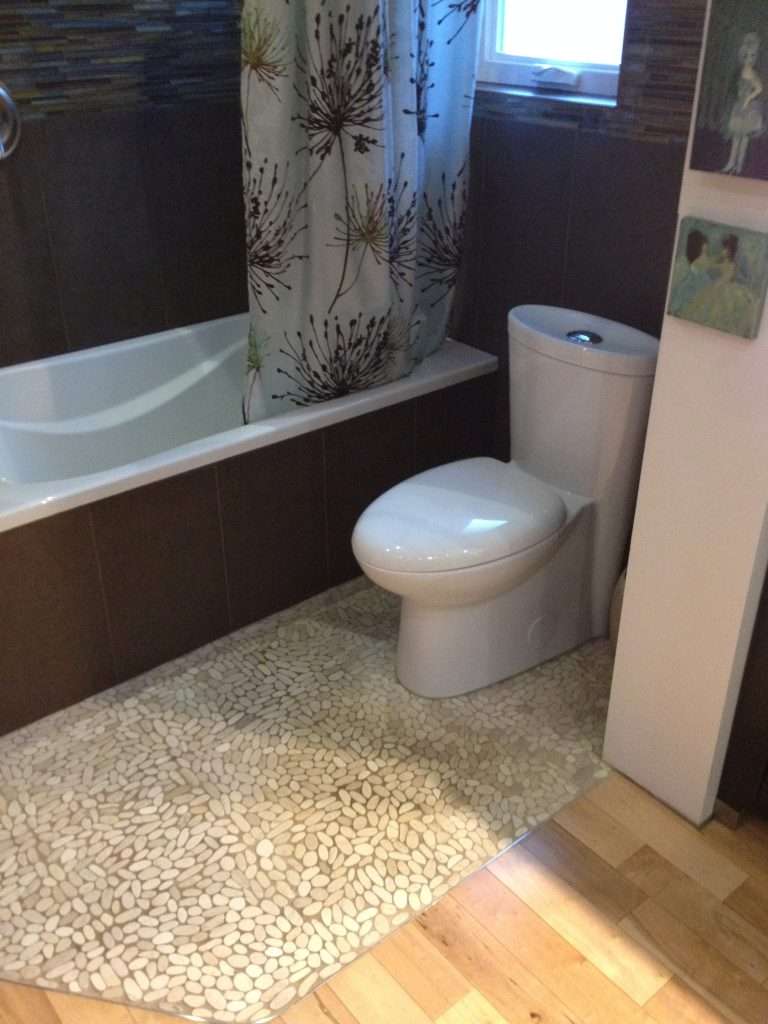 Soaker tub and heated floor river rock